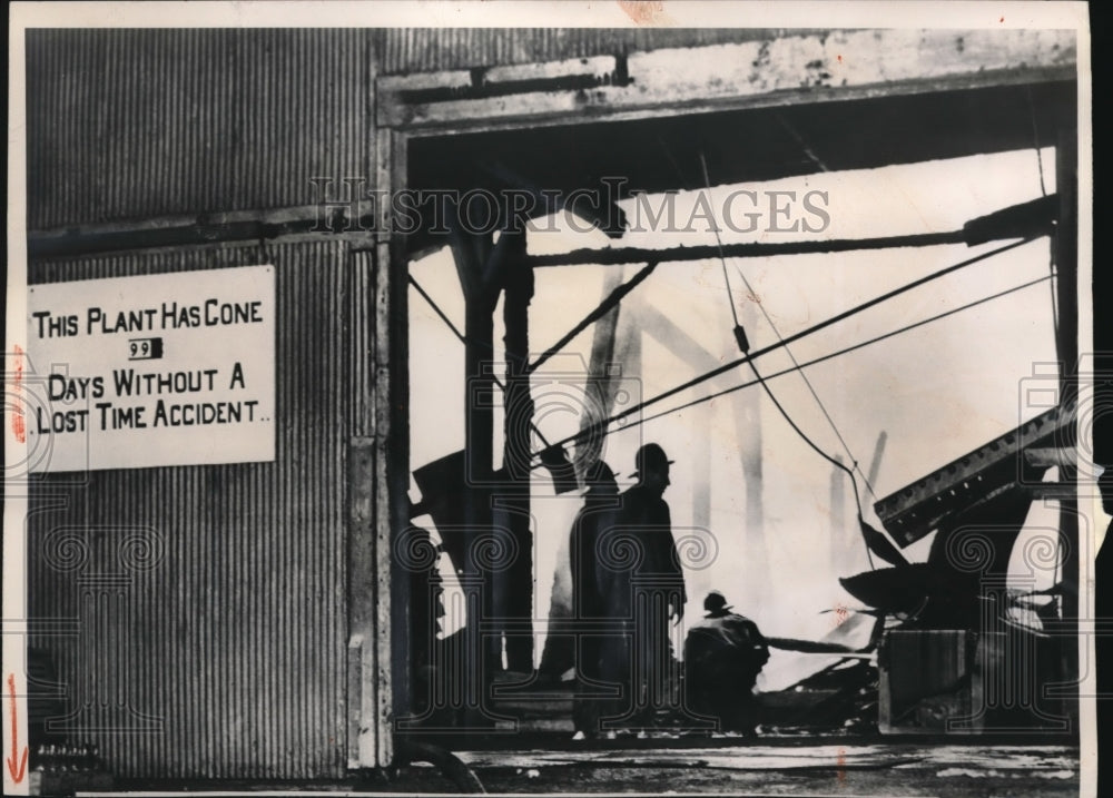 Press PhotoVirginia-Carolina Chemical Co. Fireman are shown inspecting damage - Historic Images