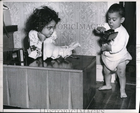 1951 Press Photo Lorna Enekian and brother's toy bank was smashed by a burglar - Historic Images