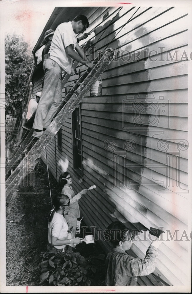 1969 PanFi Club in Norwood area painting a house - Historic Images