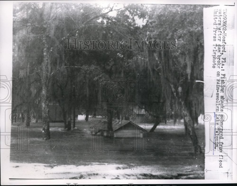 1957 Hosford Fla fishing shacks flooded after dam breaks - Historic Images