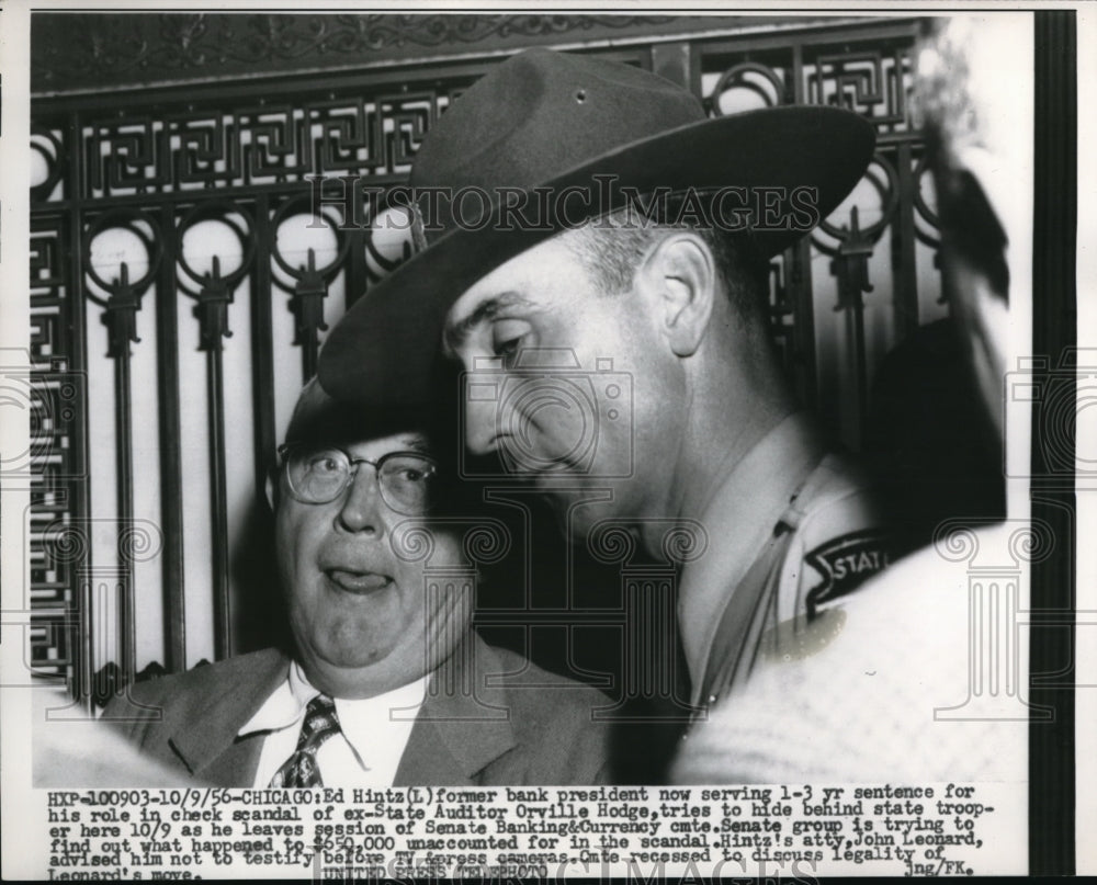 1956 Ed Hintz Hides Behind State Trooper When Leaving Court - Historic Images