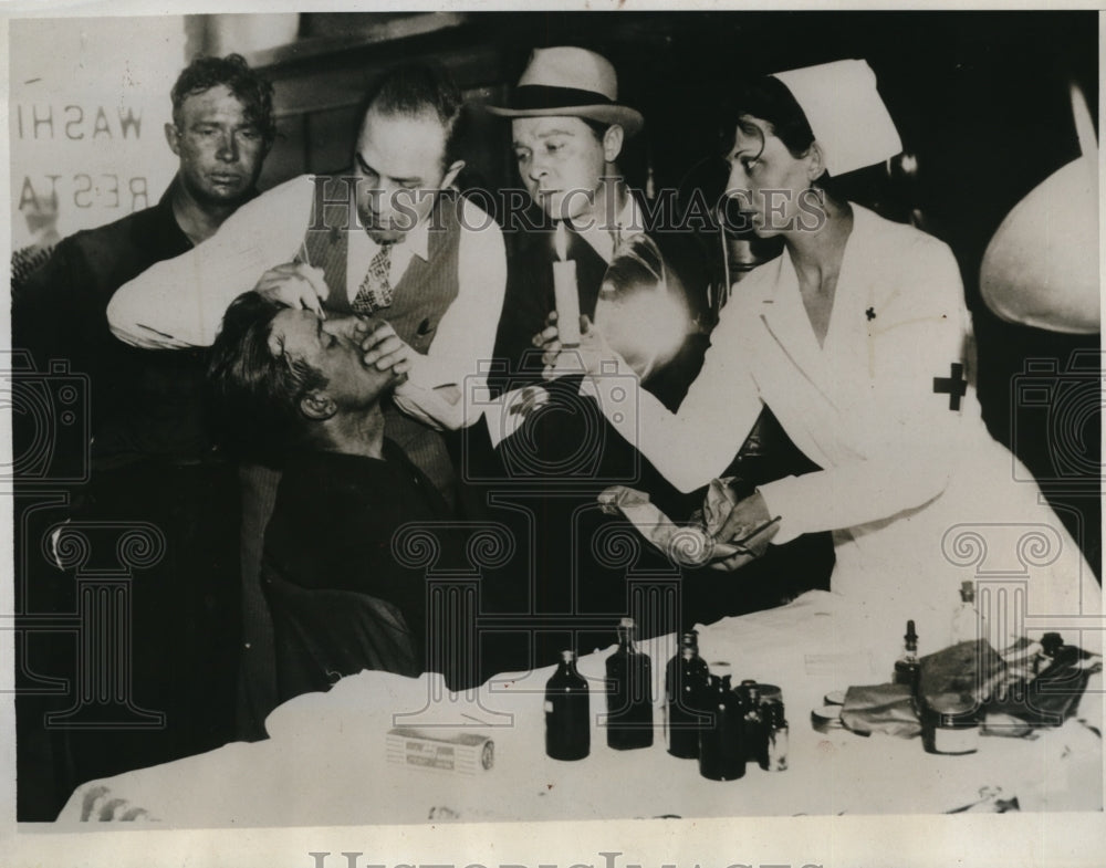 1934 Press Photo Fireman gets first aid at Chicgo stockyards fire scene - Historic Images