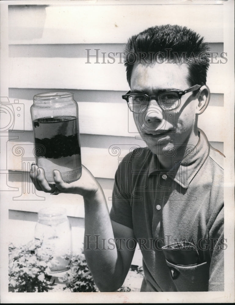 1960 Press Photo Terry Dobro &amp; jar of Japanese beetles &amp; gas to kill them - Historic Images