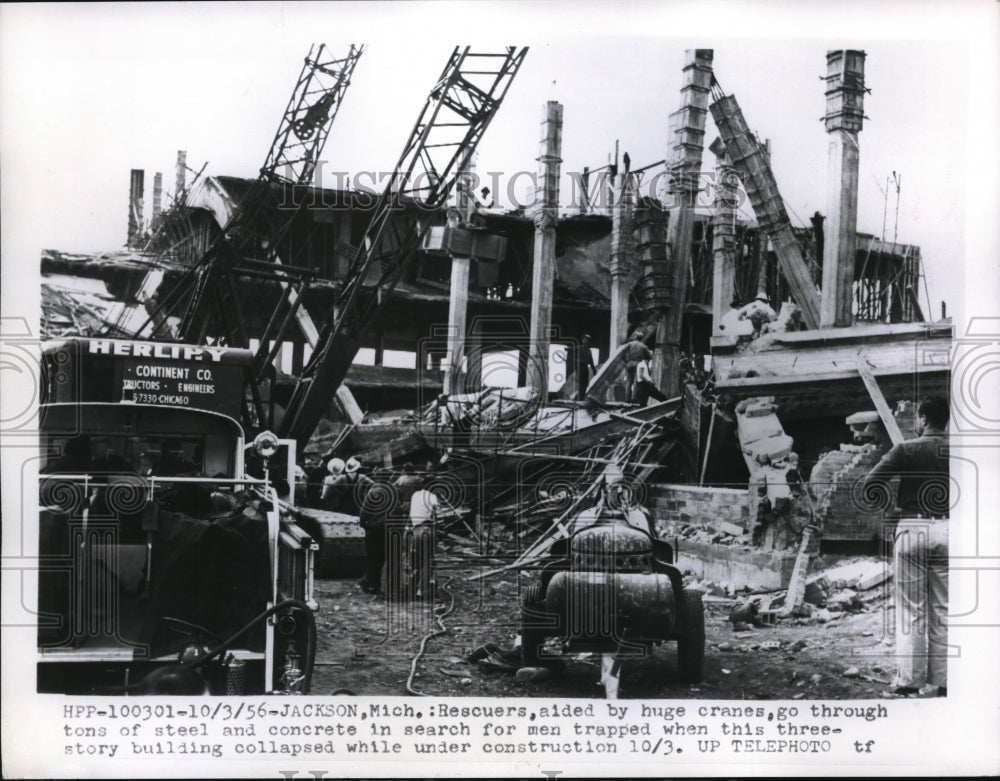 1956 Jackson Mich crans at building that collapsed under constructio - Historic Images