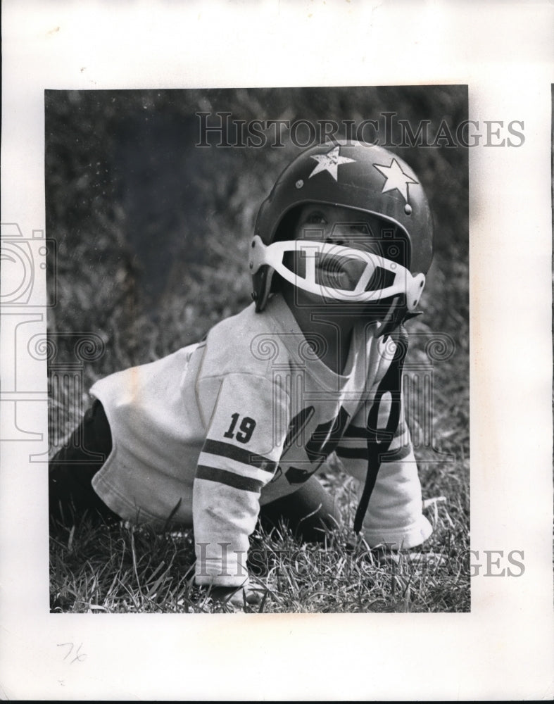 1969 Press Photo A child wearing a football uniform crawling. - Historic Images