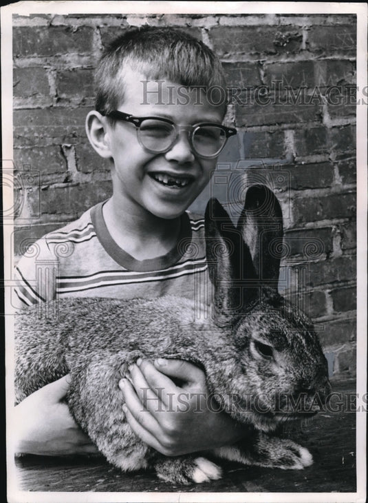1969 Press Photo David Voelker cuddles a rabbit at the APL - nec95666 - Historic Images