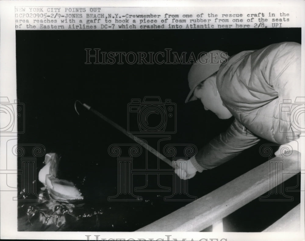 1965 Press Photo Eastern Airlines DC-7 member hook a foam rubber - nec95748 - Historic Images