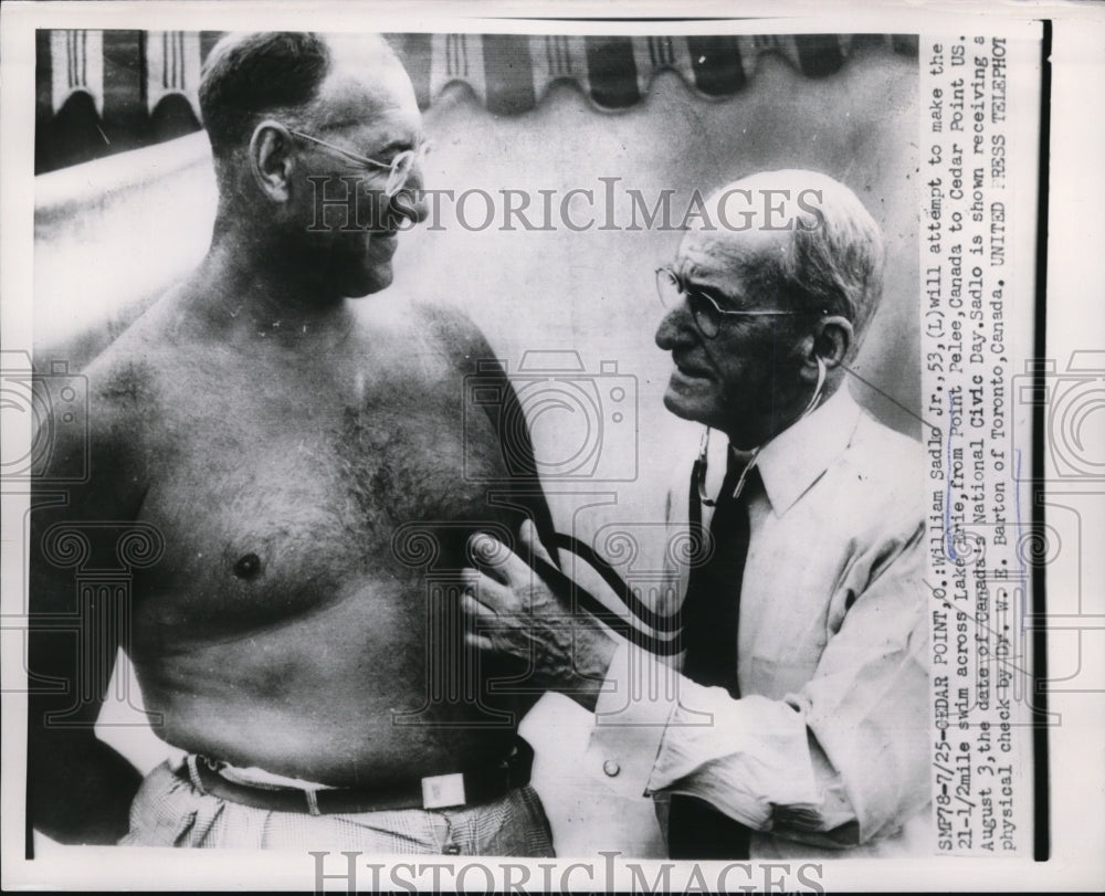 1953 Press Photo Cedar Point Ohio Wm Sadlo Jr to try Lake Erie swim &amp; Dr Barton - Historic Images