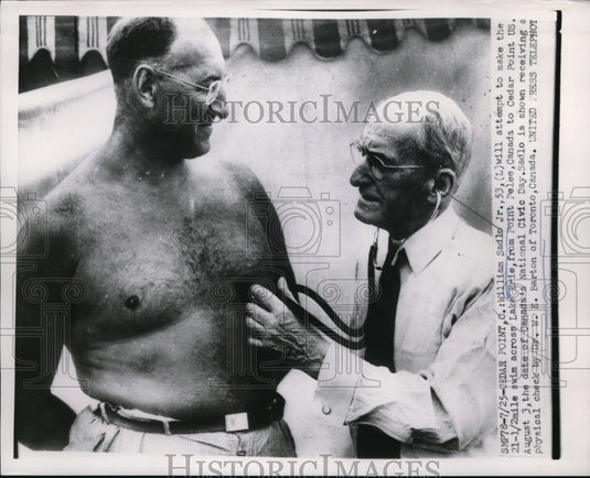1953 Press Photo Cedar Point Ohio Wm Sadlo Jr to try Lake Erie swim & Dr Barton - Historic Images