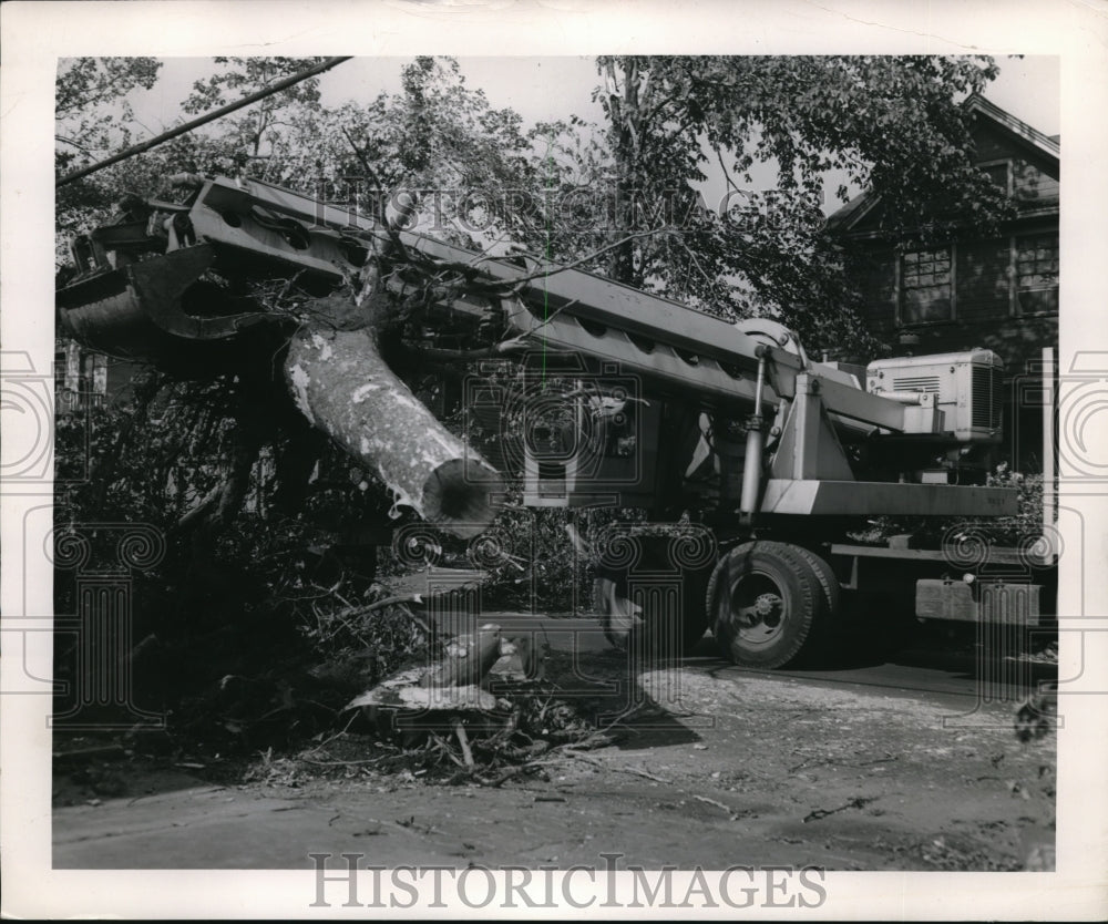 1953 Press Photo Crane clears trees from home damaged in tornado Cleveland Ohio - Historic Images