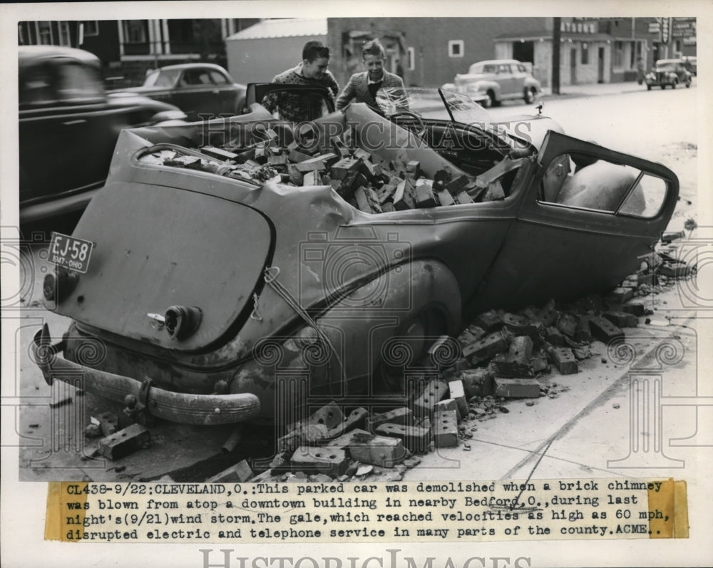 1947 Press Photo A car demolished when a brick chimney was blown down on it. - Historic Images