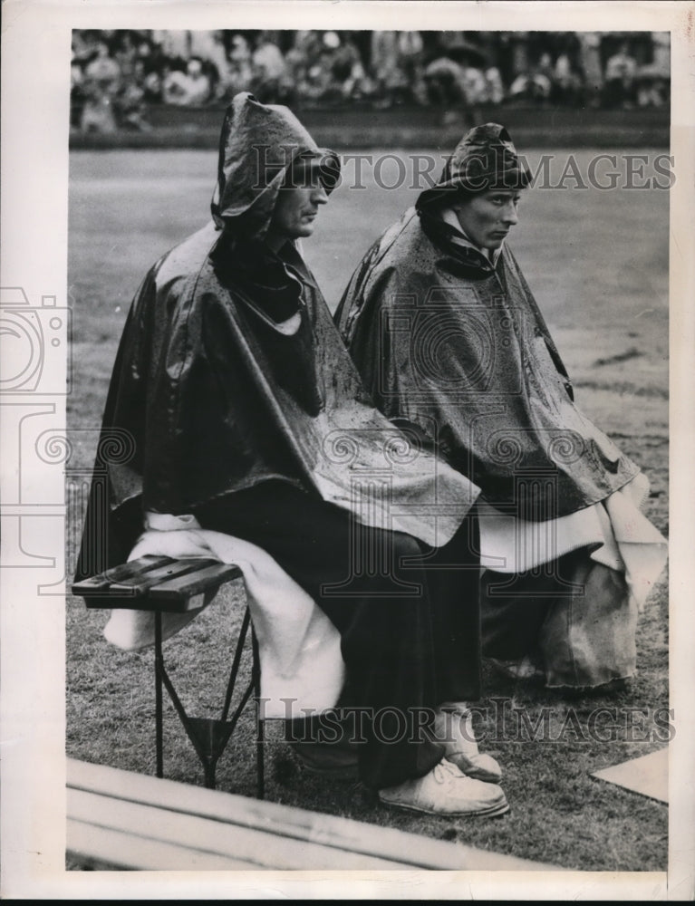 1948 Wet and glum-looking Athletes at Wembley Stadium-Historic Images