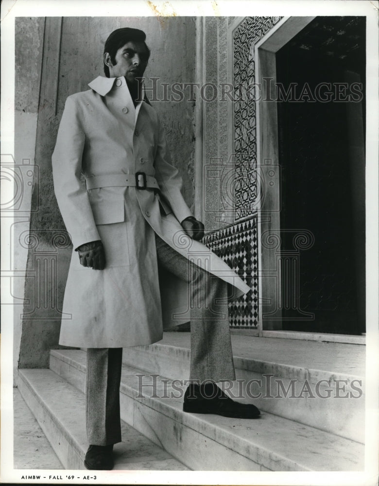 1969 Press Photo Man in new rubberized rain coat &amp; herringbone pants - Historic Images