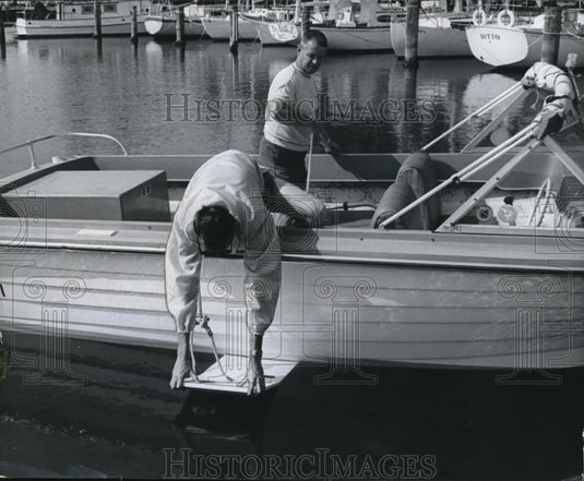 1970 Miami Beach, Fla Allaboard adjusted on boat's keel - Historic Images