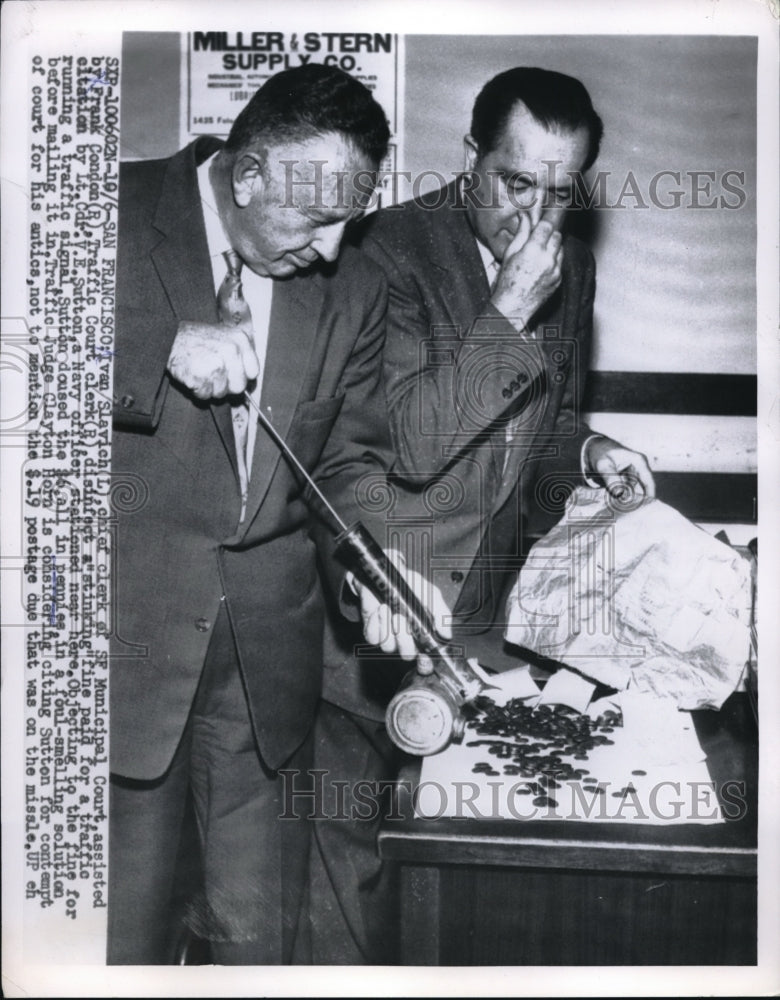 1955 Press Photo Ivan Slavich and Frank Condon disinfect fine payment - Historic Images