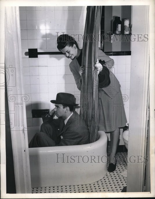 1945 Press Photo A couple check size of a bathroom's tub area - nec97586 - Historic Images