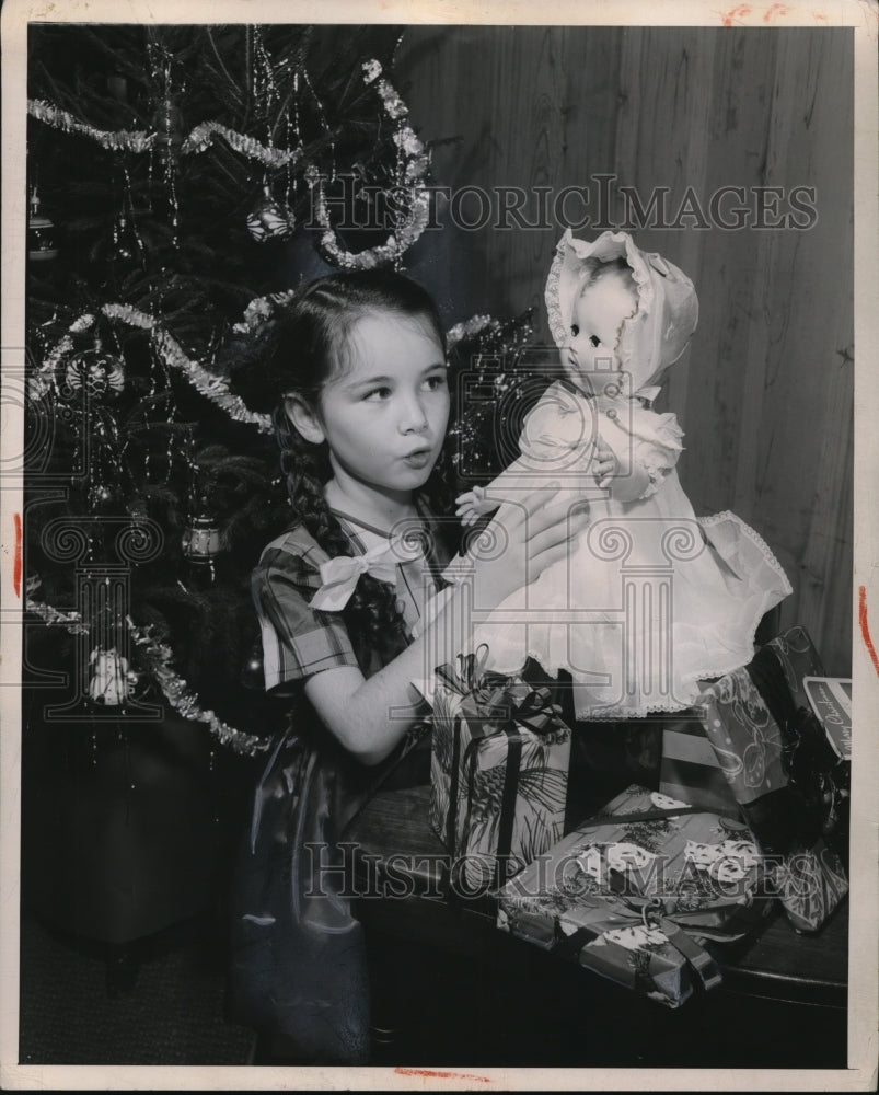 1948 Press Photo A small girl and a Christmas doll-Historic Images