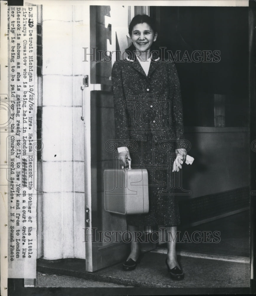 1956 Press Photo Mrs.Diezok getting ready to fly to New York to get Tanya - Historic Images