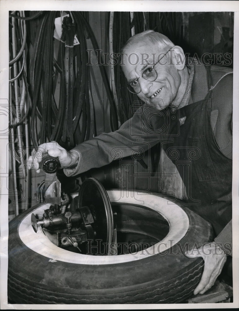 1957 Press Photo No trash for old tires by Lawrene Schuhmacher - Historic Images