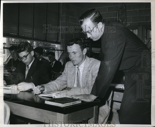 1959 Press Photo Track doesn't stop John from keeping up with lessons - Historic Images