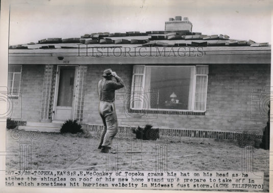 1950 Press Photo Topeka Kansas RE McConkey & roof torn up by high winds - Historic Images
