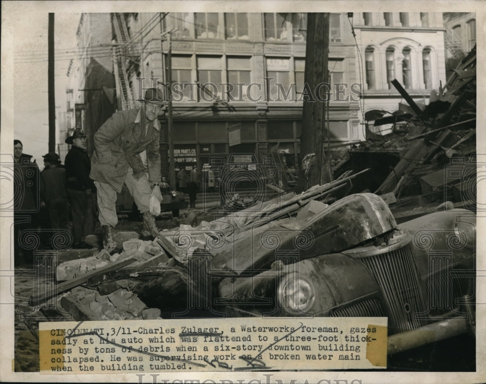 1947 Charles Zulager Waterworks foreman looks at his auto - Historic Images