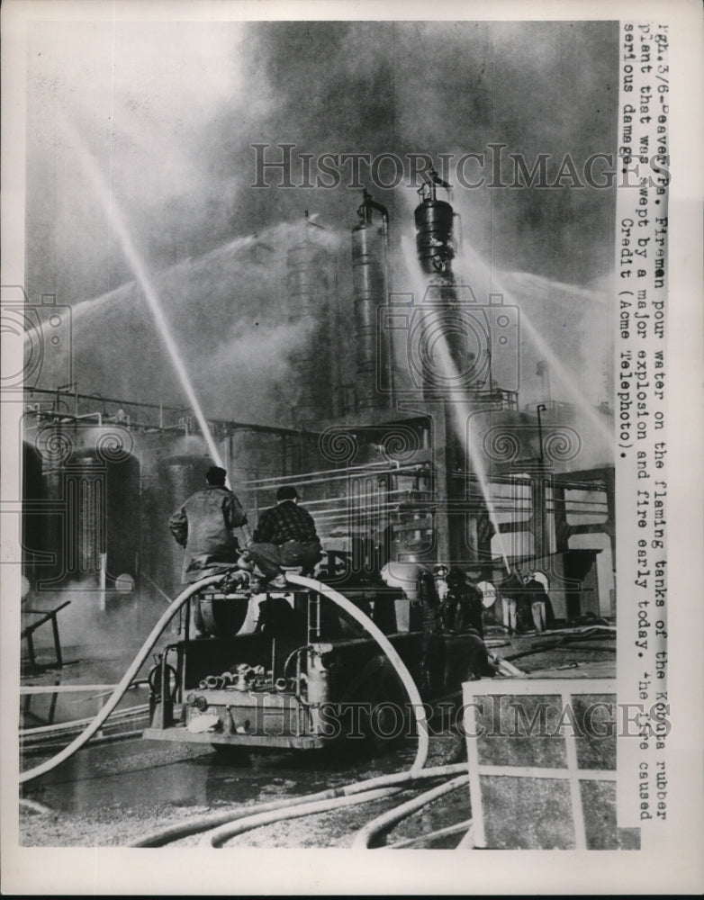 1951 Press Photo Firemen pour water on the Kobuta Rubber Plant - Historic Images