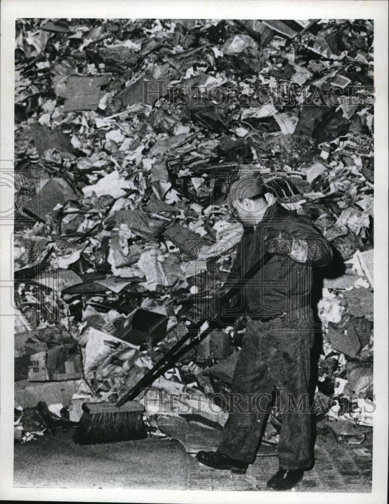 1969 Press Photo A worker sweeps up trash at a garbage collection area-Historic Images