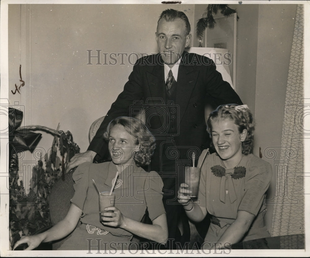 1938 Mr. and Mrs. Brenhard Larsen with Svanhildo taking a cold sip - Historic Images