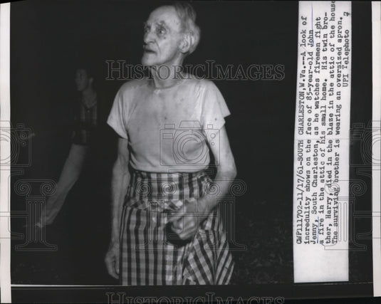 1961 John Jenny's expression as firemen fight fire at his home-Historic Images