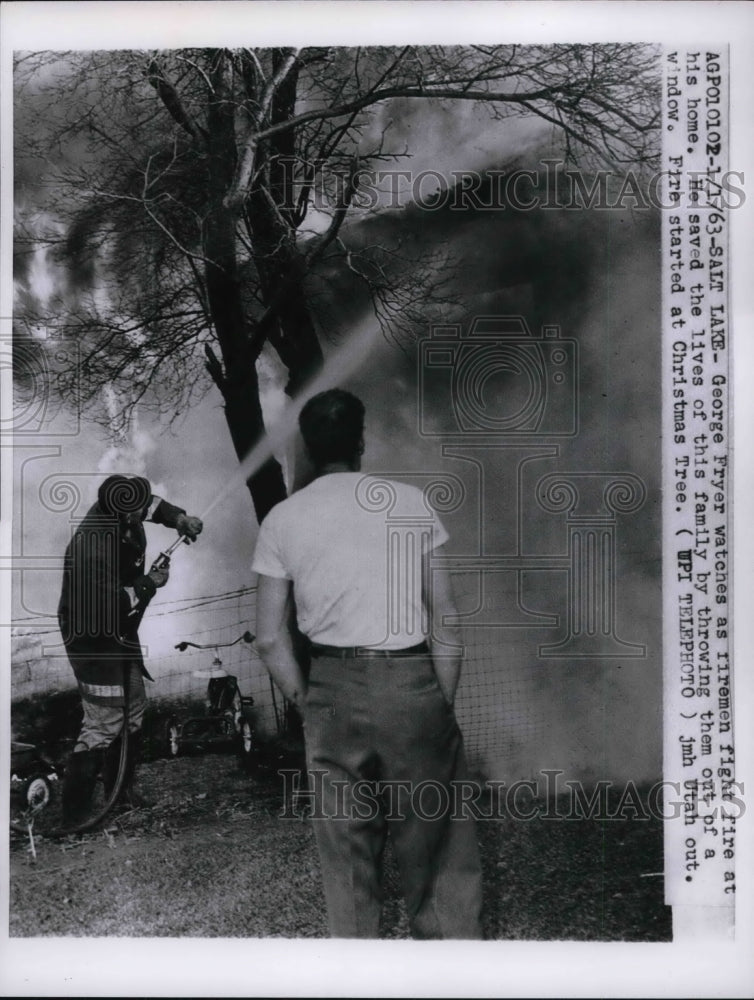 1963 Press Photo Salt Lake Utah George Fryer &amp; firemen as his home burns - Historic Images