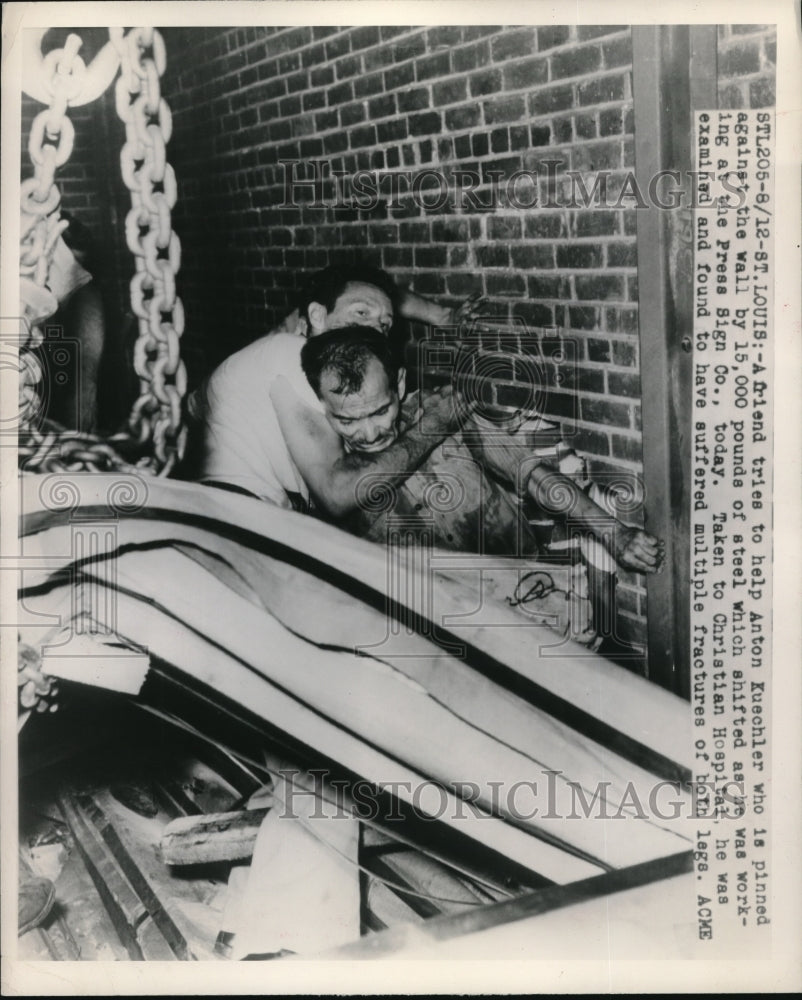 1948 Press Photo Anton Kuechler Pinned by 15,000 lbs of Steel at Press Sign Co.-Historic Images