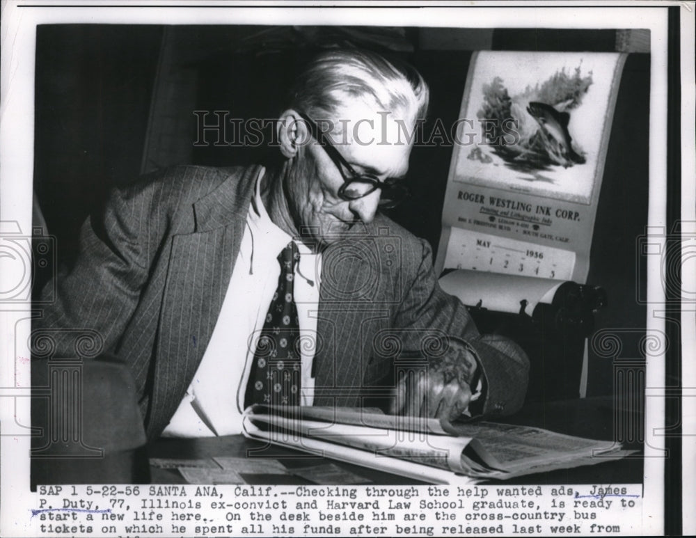 1956 Press Photo James P. Duty searches help-wanted ads - ned14701-Historic Images