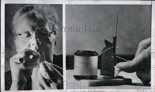 1951 Press Photo Berlin Germany new automatic needle threader demoed - Historic Images