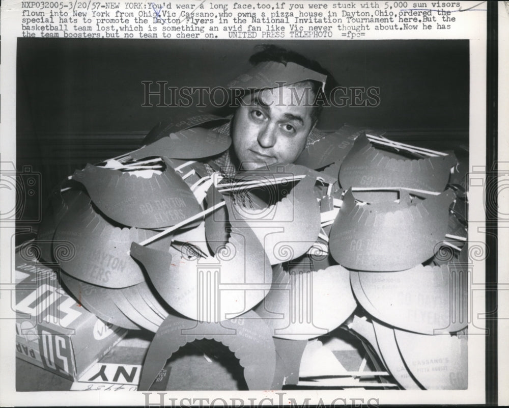 1957 Press Photo Vic Cassano Stuck with 5,000 Sun Visors Supporting the Dayton - Historic Images