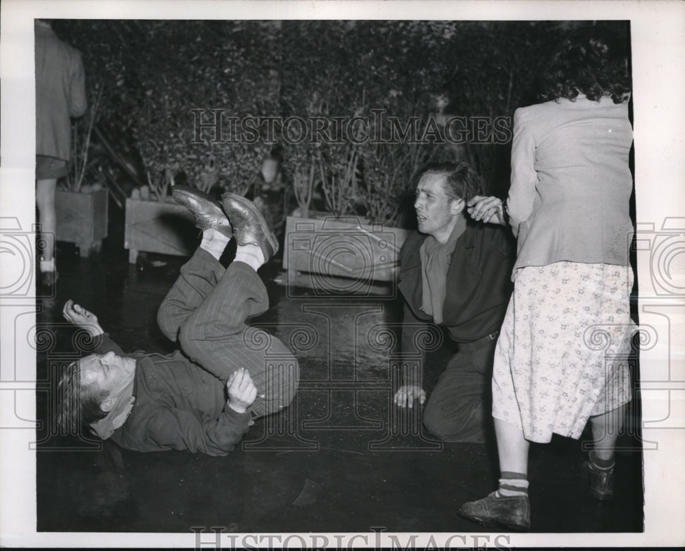 1952 Press Photo Clandestine Commandos? Topsy turvy Commies get an assist - Historic Images