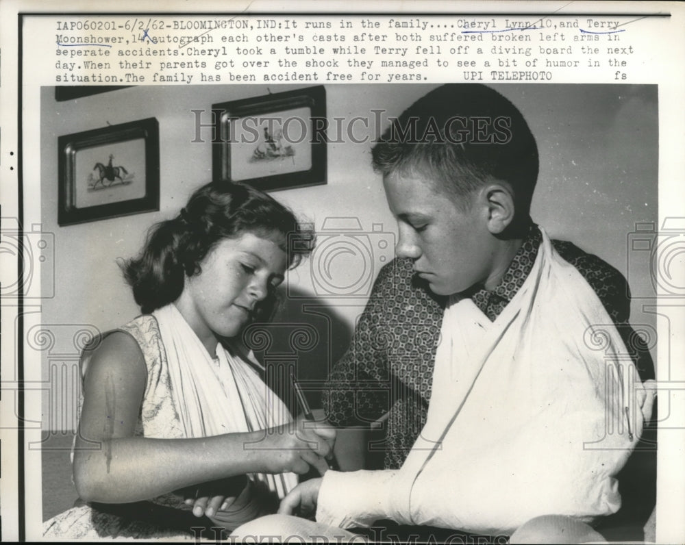 1962 Cheryl Lynn and Terry Moonshower sign each other&#39;s casts - Historic Images