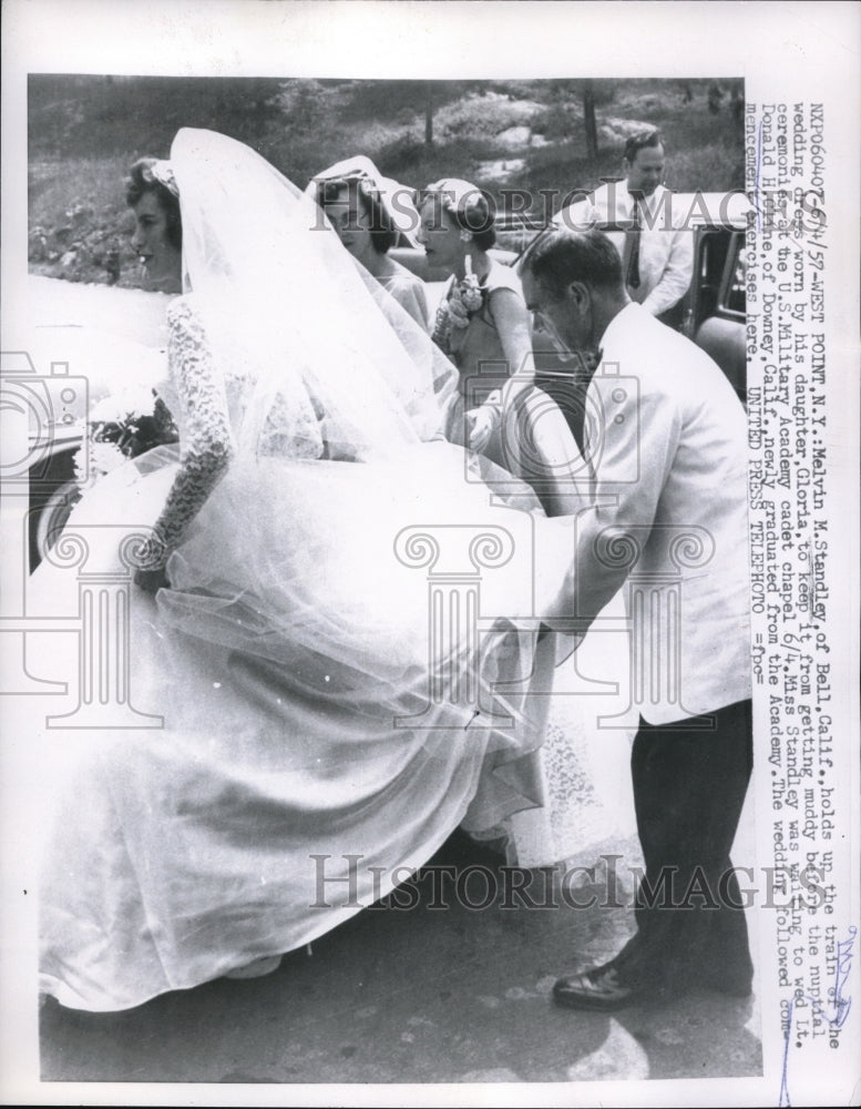 1957 Melvin L Standley helps his daughter, Gloria at her wedding. - Historic Images