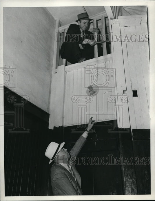 1938 Ned Keeler looking down at investigator John Biasotti - Historic Images