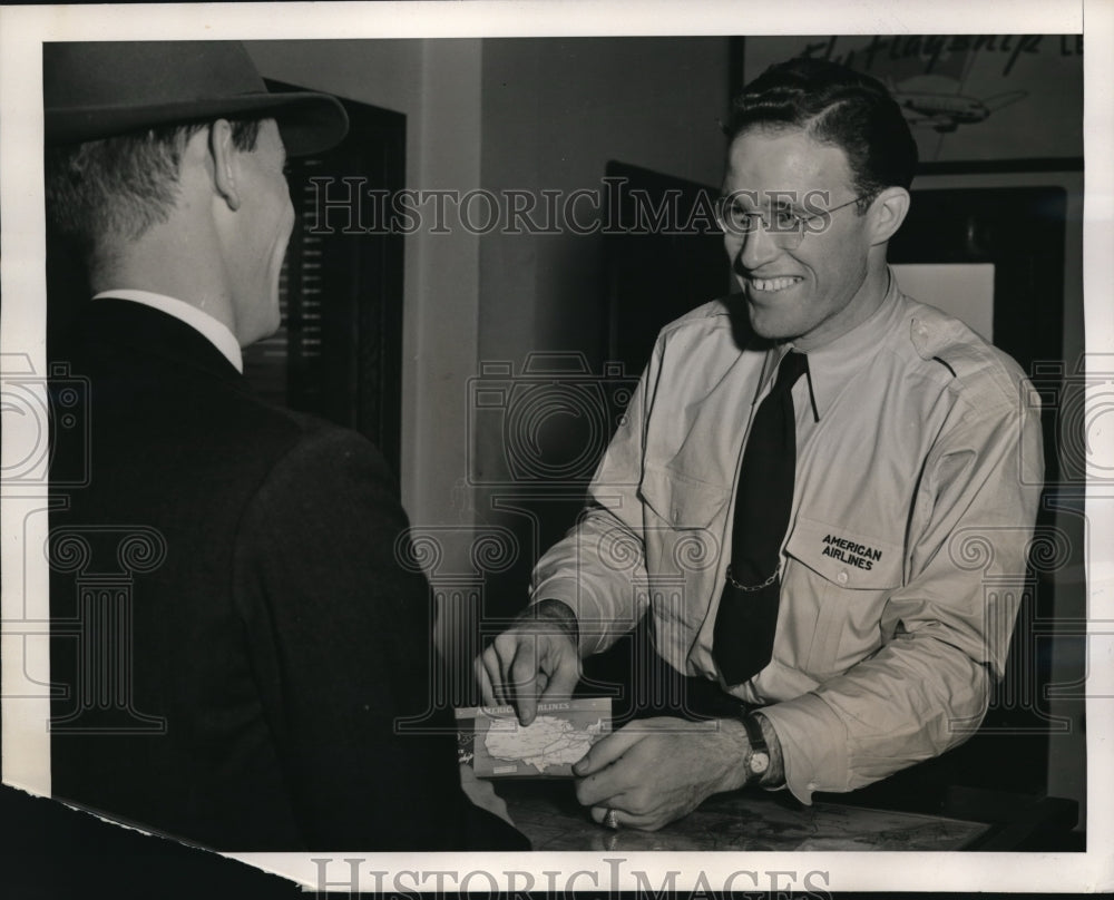 1940 Jim Moffity behind the ticket counter at Hartford - Historic Images