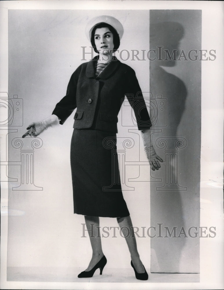 1957 Press Photo Jean Patou cuts both skirt and jacket short in-Historic Images