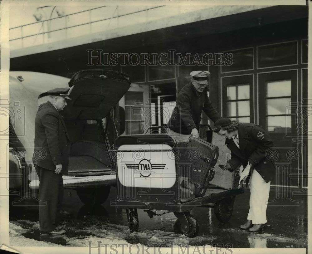 1943 Mary Cowan Checks the Luggage Carefully  - Historic Images