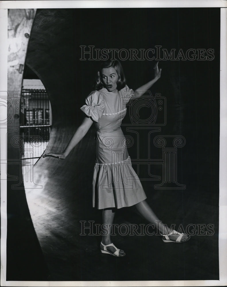 1957 Press Photo Woman modeling a pastel chambray dress. - Historic Images