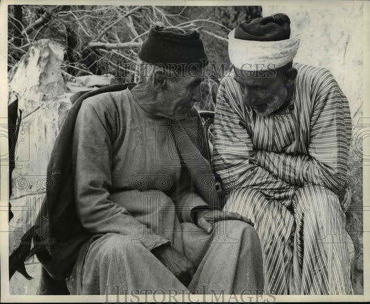 1958 Press Photo Village Resident two men in deep discussion.-Historic Images