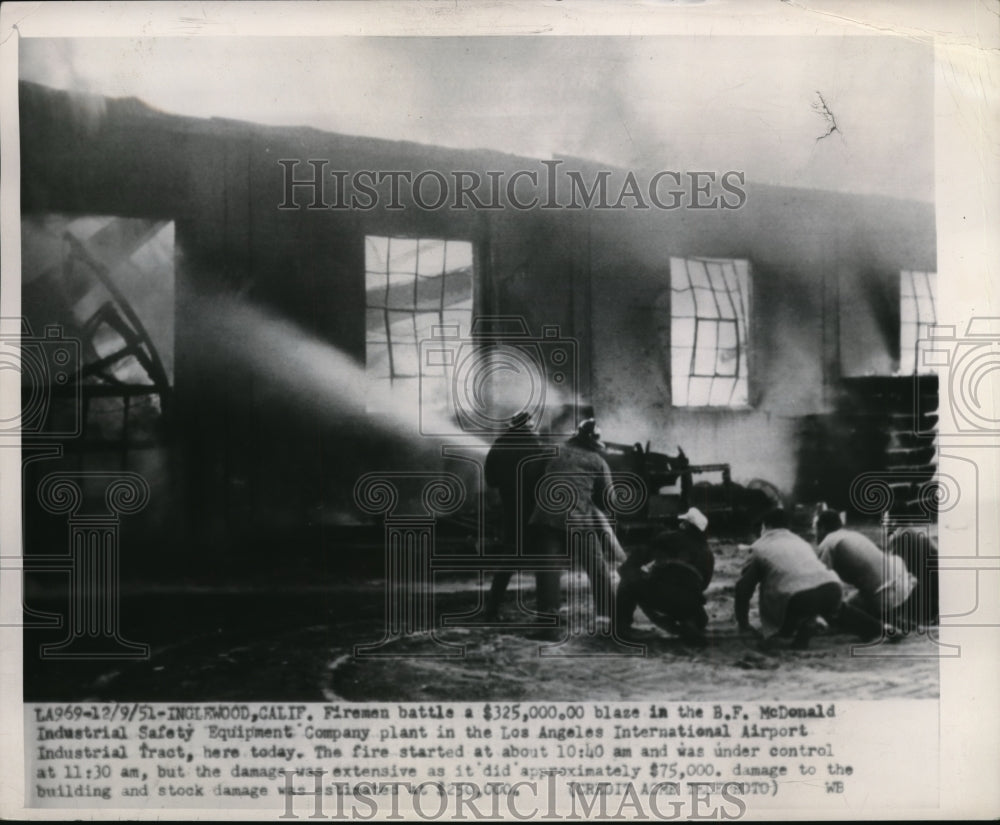 1951 Press Photo Firemen battle B.F.McDonald Industrial plant blazing fire-Historic Images