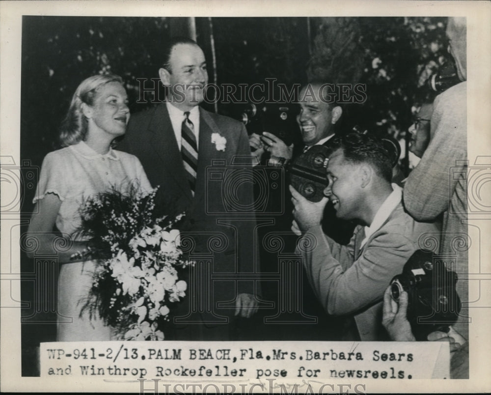 1948 Press Photo Mrs. Barbara Searsand Winthrop Rockefeller pose for newsreels - Historic Images