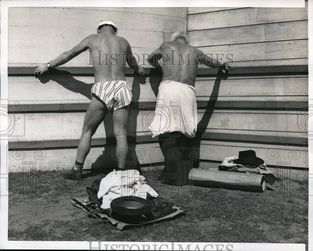 1956 Press Photo Men taking advantage of the warm weather to get their suntans-Historic Images