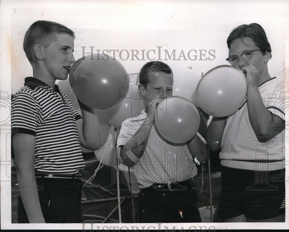 1957 Press Photo Boys Blowing Up Balloons, Rocky River Junior High School Bazaar-Historic Images