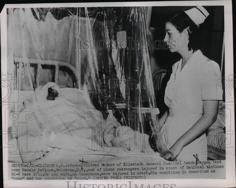 1952 Press Photo Nurse Mildred McGarr Checks Harold DeFiore, Plane Crash Victim-Historic Images