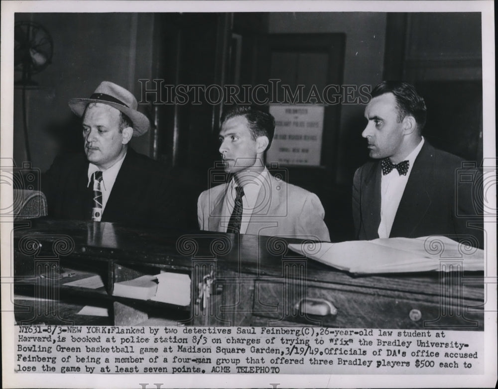 1951 Press Photo Saul Feinberg, law student at Harvard, is booked at police-Historic Images